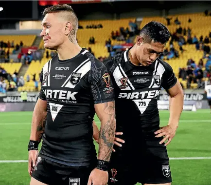  ?? PHOTO: GETTY IMAGES ?? Kiwis Danny Levi and Roger Tuivasa-Sheck look dejected after the shock loss in their World Cup quarterfin­al match against Fiji.