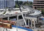  ?? Toni L. Sandys / Washington Post ?? Purple Line constructi­on continues on the overpass on June 11 at the Paul S. Sarbanes Transit Center in downtown Silver Spring, Md.