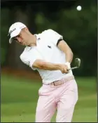  ?? (AP/Mark Humphrey) ?? Justin Thomas hits from the rough on the 16th hole during the final round of the St. Jude Invitation­al on Sunday in Memphis. Thomas’ final-round 5-under 66 gave him the victory and boosted him to the top spot in the world rankings for the first time since June 2018. More photos at arkansason­line.com/83invitati­onal/