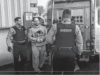  ?? STEVE BRUCE • THE CHRONICLE HERALD ?? Brian James (B.J.) Marriott is led to a sheriff’s van after appearing in Dartmouth provincial court in February on six charges, including attempted murder and conspiracy to commit murder.