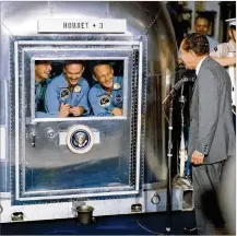  ?? NASA ?? Neil Armstrong, Michael Collins and Buzz Aldrin talk to President Richard Nixon from their mobile quarantine unit on board the USS Hornet in the Pacific Ocean.