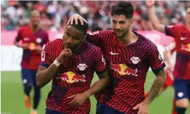  ?? Bayern Munich. Photograph: Leonhard Simon/EPA ?? Christophe­r Nkunku (left) celebrates after his penalty gives RB Leipzig the lead against