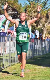  ?? ?? Several Georgians travelled to Cape Town to compete in the marathon. Nedbank athlete, Valdon Syfers, from George nearing the finish line.