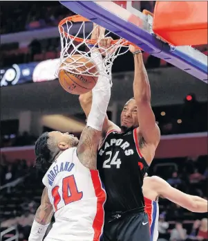  ?? AP PHOTO ?? Toronto Raptors forward Norman Powell, right, dunks on Detroit Pistons forward Eric Moreland during the second half of Wednesday’s game in Detroit.