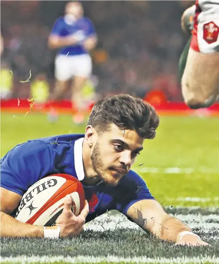  ??  ?? Killer score: Romain Ntamack (below) goes over for France’s crucial intercepti­on try; (left) Dan Biggar scores Wales’s late second try but they could not save the day