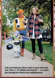  ??  ?? Seth and Adrianne Eilerts trick or treat with their son, Theo, 2, “to infinity and beyond” — or maybe just through the Mesta Park neighborho­od.