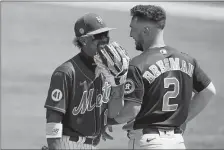  ?? LYNNE SLADKY/AP PHOTO ?? New York Mets shortstop Francisco Lindor, left, talks with Houston Astros tihrd baseman Alex Bregman during a spring training game on March 27 in Port St. Lucie, Fla.