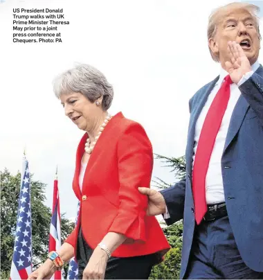  ??  ?? US President Donald Trump walks with UK Prime Minister Theresa May prior to a joint press conference at Chequers. Photo: PA