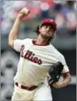  ?? DERIK HAMILTON — THE ASSOCIATED PRESS ?? Philadelph­ia Phillies starting pitcher Aaron Nola to the plate during Wednesday’s game against the Orioles.
