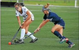  ?? GENE WALSH — DIGITAL FIRST MEDIA ?? Plymouth Whitemarsh’s Ava Borkowski receives a pass as North Penn’s Bri O’Donnell defends during their District 1-3A second round game Wednesday.