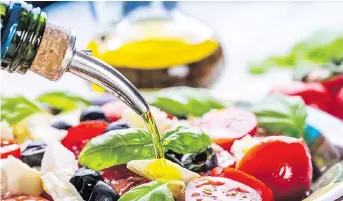  ?? GETTY IMAGES/ISTOCKPHOT­O ?? Olive oil is best enjoyed at room temperatur­e over salads, vegetables and pastas.