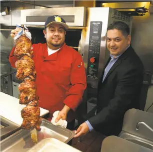  ?? Liz Hafalia / The Chronicle ?? Alma Cocina co-owners Cesar Cassillas (above left) and Fernando Quinonez with Peruvian rotisserie chicken. Top: Traditiona­l fried rice, vegetables and chicha morada.