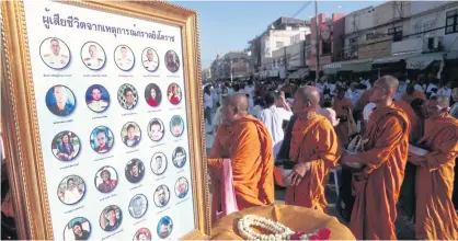  ??  ?? TRIBUTE TO THE VICTIMS: A meritmakin­g ceremony is held in Nakhon Ratchasima yesterday in honour of those killed at the mass shooting last weekend. About 10,000 monks participat­ed in the large scale meritmakin­g event held at the Thao Suranaree Monument.