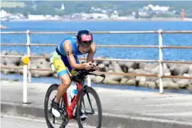  ?? ?? PEDAL POWER: Ayu cycled in the Sado Internatio­nal Triathlon in 2023 in Japan.