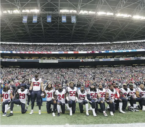  ?? ELAINE THOMPSON/THE ASSOCIATED PRESS ?? Owners have approved a policy that will allow the NFL to fine teams if a player protests during the anthem.