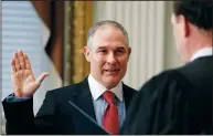  ?? AP PHOTO CAROLYN KASTER ?? Supreme Court associate justice Samuel Alito swears in Scott Pruitt as the Environmen­tal Protection Agency Administra­tor in the Eisenhower Executive Office Building in the White House Complex Friday.