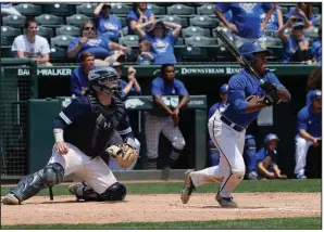  ?? NWA Democrat-Gazette/ANDY SHUPE ?? Shortstop Deshaun Cordova (right) hit an RBI single in the 10th inning Monday, scoring John Henry Maloch from second base, to give North Little Rock a 5-4 victory over Springdale Har-Ber for its third state title despite finishing with a 15-18 record.