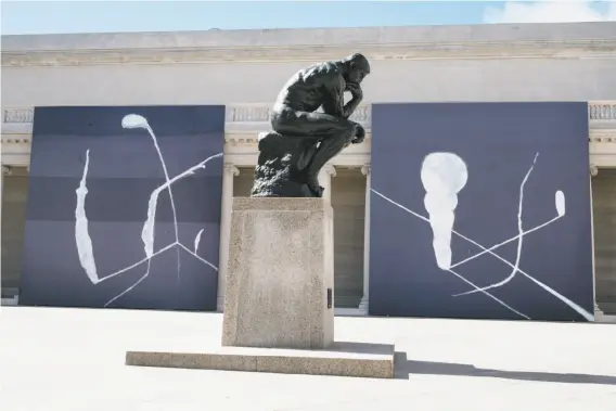  ?? Mason Trinca / Special to The Chronicle ?? “Julian Schnabel: Symbols of Actual Life” paintings are on display near Rodin’s “The Thinker “in the courtyard at the Legion of Honor in San Francisco.