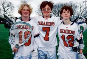  ?? MATTHEW J. LEE/GLOBE STAFF ?? Senior goaltender Finn Granara (left) and his brother Cullen (right), a sophomore attack, have teamed up with cousin Robbie Granara, a senior attack, for undefeated Reading.