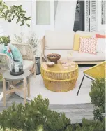  ?? ?? OUTSIDE EDGE: Cradle rope sofa, £850, and Salsa orange table, £149. Cushions £15 each. All from www.johnlewis.com