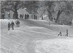  ?? MICHAEL LEHMKUHLE/THE ADVOCATE ?? Visitors climb Observator­y Mound at the Octagon Earthworks after a tour on Oct. 15, 2023. The Ohio History Connection held events at the Great Circle and Octagon Earthworks to celebrate their designatio­n as UNESCO World Heritage Sites.