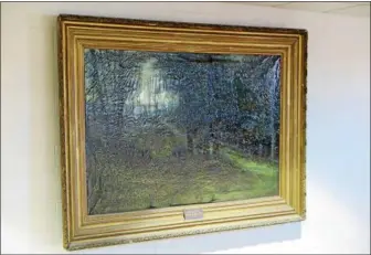  ?? SUBMITTED PHOTO ?? The painting that once hung in the Boyertown Area High School Library is of a woodland scene painted by Berks County artist Victor Schearer in 1919.