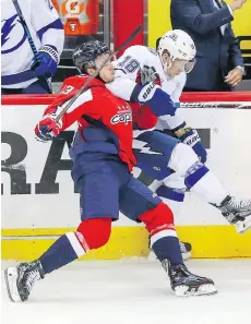  ?? DIRK SHADD/THE ASSOCIATED PRESS ?? The Capitals’ Jakub Vrana checks the Tampa Bay Lightning’s Ondrej Palat during Game 6 on Monday.