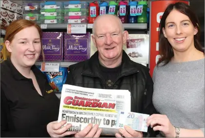  ??  ?? Cash winner Frank Delaney from Templeshan­non at O’Callaghan’s Centra with Sarah Louise Kearney of O’Callaghans Centra and Donna Murphy of the Guardian newspaper.