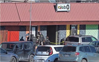  ?? HELEN H. RICHARDSON/THE DENVER POST ?? Colorado Springs police, the FBI and others investigat­e the scene of a shooting at Club Q in Colorado Springs, Colo. on Sunday. An attacker opened fire in the gay nightclub late Saturday night.