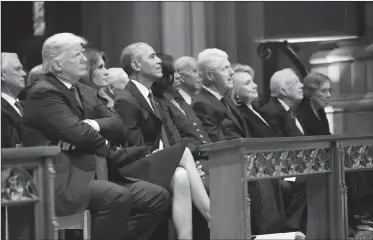  ?? Associated Press photo ?? From left, President Donald Trump, first lady Melania Trump, former President Barack Obama, former first lady Michelle Obama, former President Bill Clinton, former Secretary of State Hillary Clinton, and former President Jimmy Carter and former first lady Rosalynn Carter, listen as former President George W. Bush speaks during a State Funeral at the National Cathedral, Wednesday in Washington, for former President George H.W. Bush.