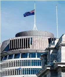 ?? —Bloomberg ?? Rememberin­g the fallen: A flag is flown at half-mast in honour of the victims at the New Zealand Parliament Building in Wellington.
