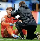  ?? ?? BIG POINT: Medical staff do a concussion test on Lincoln goalkeeper Carl Rushworth