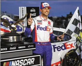  ?? MATT SLOCUM / AP ?? Denny Hamlin topped Kevin Harvick on Sunday night to win the second Cup race of the weekend at Pocono Raceway and flip the result of the opener.