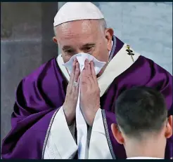  ??  ?? STRUGGLING: Pope wipes his nose during a Vatican service