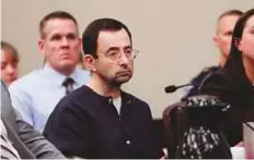  ?? AP ?? Sports doctor Larry Nassar sits during his sentencing hearing earlier this year, in Lansing, Michigan. Nassar was convicted of abusing more than 300 women and girls.