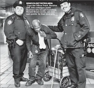  ??  ?? BENEVOLENT PATROLMEN: Cops like Officer Frank Rendina (left, with colleague Justin Guzman) who bought homeless Ronald Brown socks, can now earn points for their kind acts.