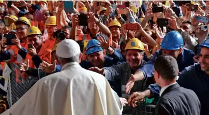  ?? —AP ?? Pope Francis is cheered by workers at the Ilva steel-making company in Genoa, Italy.