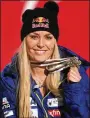  ?? PHOTOS BY CHRISTOPHE PALLOT / AGENCE ZOOM / GETTY IMAGES ?? Lindsey Vonn wins the bronze medal during the FIS World Ski Championsh­ips Women’s Downhill on Sunday in Sweden. “I knew that I was capable of pushing through the pain one last time and I did that,” she said.