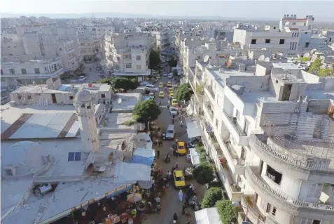  ??  ?? A general view taken with a drone shows part of the rebel-held Idlib city, Syria.