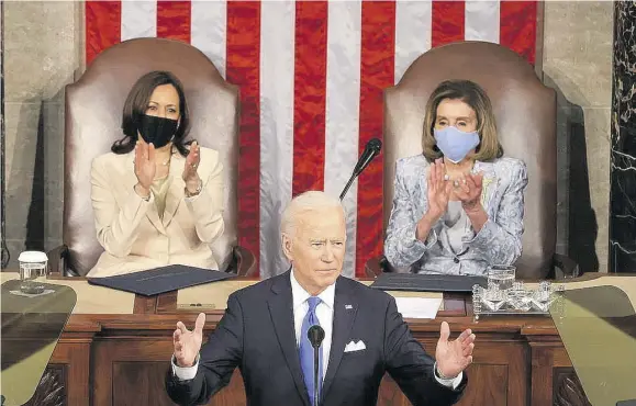  ??  ?? US President Joe Biden addresses a joint session of Congress as behind him Vice-president Kamala Harris (left) and House Speaker Nancy Pelosi look on in the House chamber of the US Capitol.