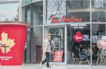  ?? STR/AFP VIA GETTY IMAGES ?? A Tim Hortons premises