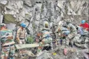  ??  ?? Army personnel during a rescue operation after a landslide in Kinnaur district on Thursday.