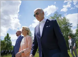  ?? SUSAN WALSH — THE ASSOCIATED PRESS ?? President Joe Biden walks with European Council President Charles Michel and European Commission President Ursula von der Leyen, as they head to a photo op with the G7 leaders at the G7 Summit in Elmau, Germany, on Sunday. Biden’s “America is back” message to allies hasn’t aged well.