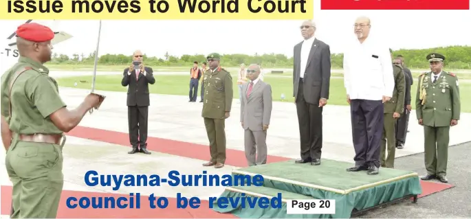  ??  ?? President David Granger (left) and President Désiré Delano Bouterse being accorded the Guard of Honour Salute at the Eugene F. Correia Internatio­nal Airport. (Ministry of the Presidency photo)