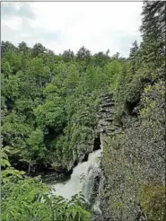  ?? PARIS WOLFE — THE NEWS-HERALD ?? Visitors must hike nearly 1.5 miles to view the tiered Linville Falls.