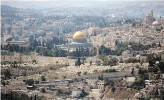  ??  ?? No image says Jerusalem like the postcard view of its Old City — with its towering ancient walls, the Western Wall and the glimmering gold-topped Dome of the Rock. An Israeli plan to build a cable car system to the Old City has united architects and Palestinia­n activists in their opposition to the project.