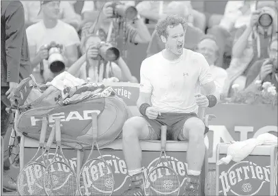  ?? SuSAN MullANE/ USA TODAY ?? Britain’s Andy Murray, the No. 3 seed, tries to fire himself up during a changeover against Novak Djokovic of Serbia during their French Open semifinal match in Paris on Friday. Djokovic led 6-3, 6-3, 5-7, 3-3 when play was halted for the day because...