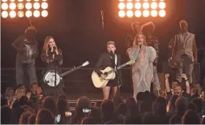  ?? RICK DIAMOND/GETTY IMAGES ?? Beyoncé and the Dixie Chicks, now known as The Chicks, perform at the Country Music Associatio­n (CMA) Awards in 2016 in Nashville.