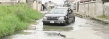  ??  ?? A flooded road