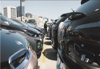  ?? Peter Earl McCollough / Special to The Chronicle ?? Zero emission electric cars lined up at the BMW dealership in San Francisco will help to meet Gov. Jerry Brown’s executive order to reduce greenhouse gases in California by 2030.